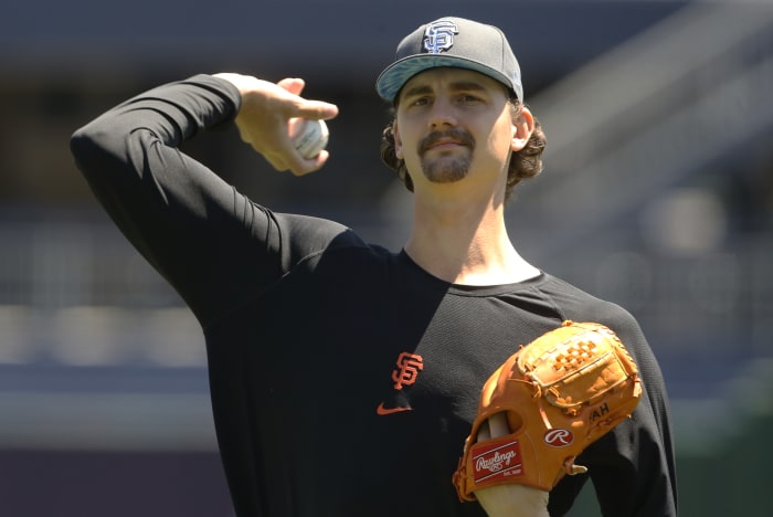 SF Giants pitcher Sean Hjelle warms up before a game.